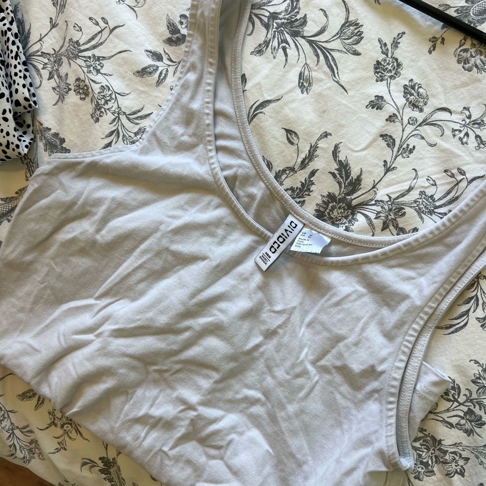 Bundle of 10 tanks/ camis/ under shirt tanks.